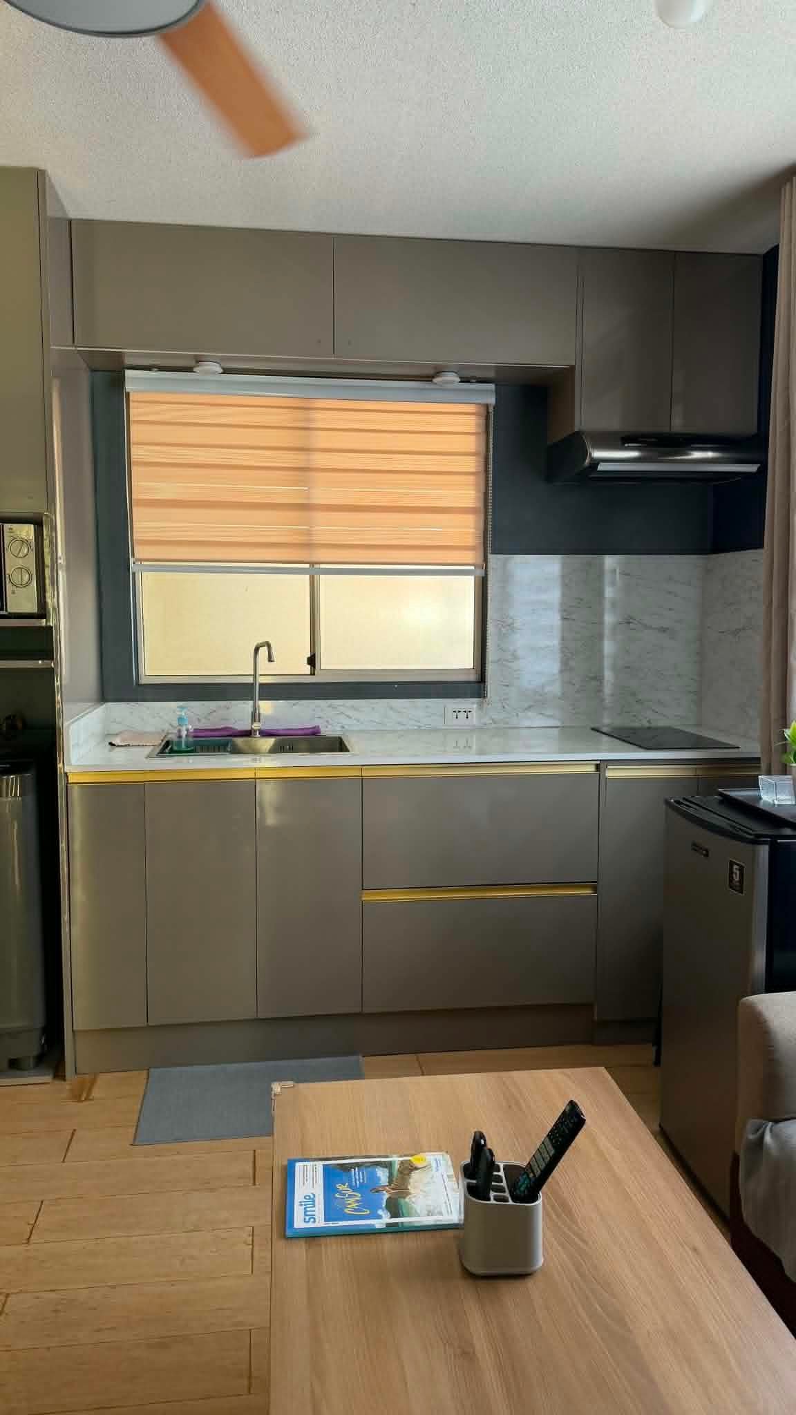 Spotless condo kitchen with polished marble countertop